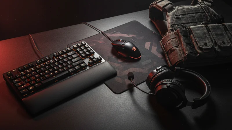 Tactical FPS gaming setup with mechanical keyboard, mouse, headset and tactical vest — CS2 betting at Maxim88